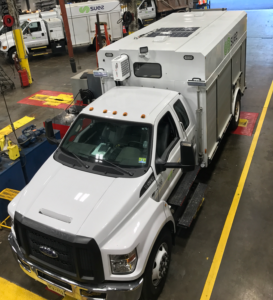 suez truck with solar panel on roof